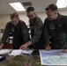 U.S. Marines with Marine Aerial Refueler Transport Squadron (VMGR) 252 conduct mission planning