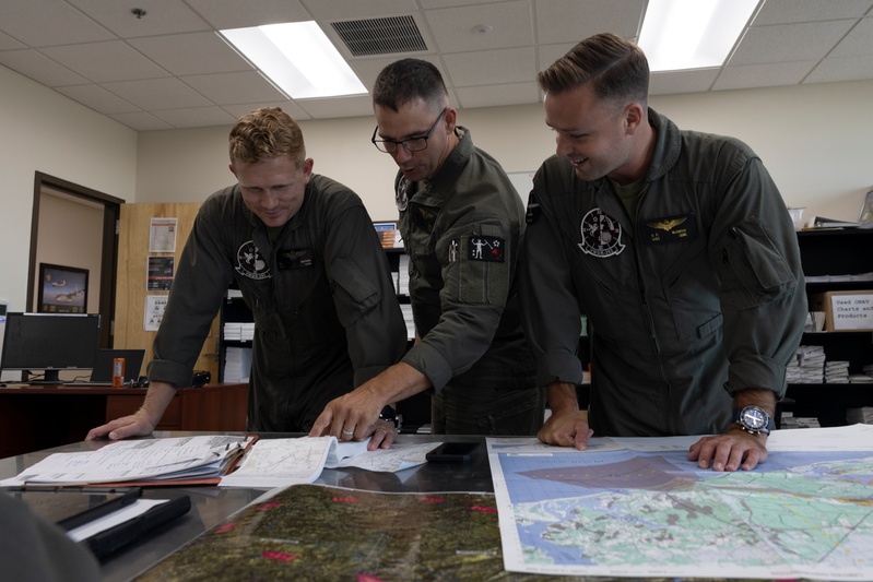 U.S. Marines with Marine Aerial Refueler Transport Squadron (VMGR) 252 conduct mission planning