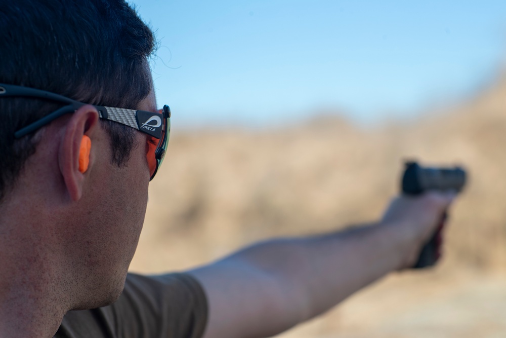 USS Tripoli Sailors compete in a shooting compitition