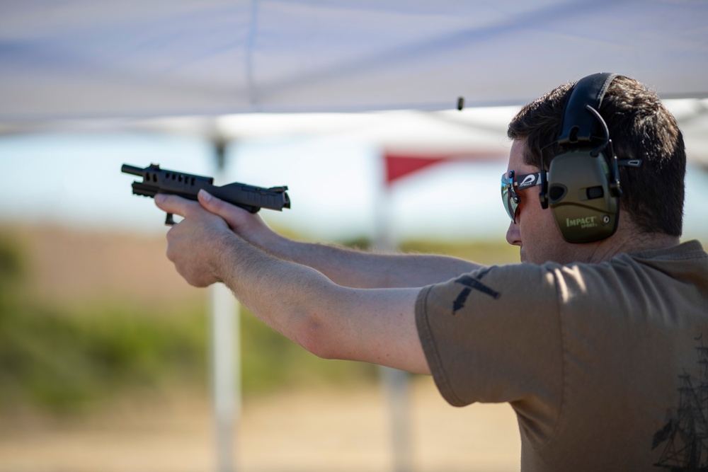 USS Tripoli Sailors compete in a shooting compitition