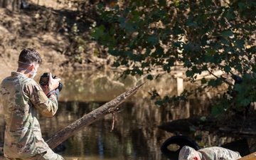 Tennessee National Guard public affairs specialist documents soil collection after Hurricane Helene