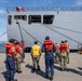 USS Ronald Reagan (CVN 76) Sailors assist in mooring Peruvian supply ship