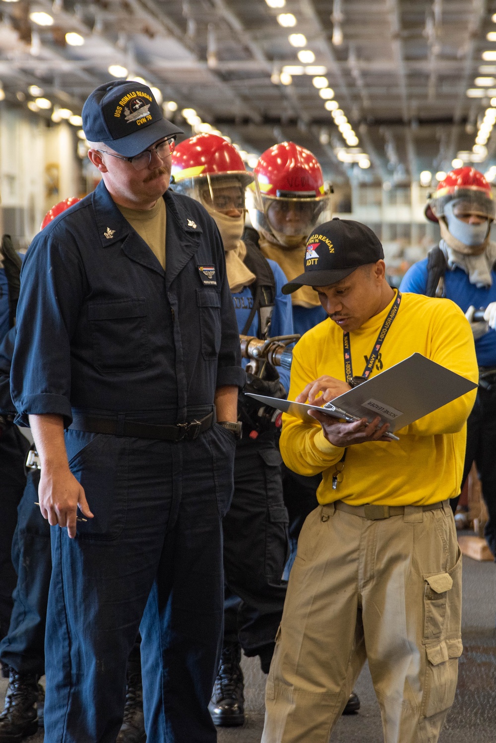 USS Ronald Reagan (CVN 76) Sailors conduct training during a general quarters drill