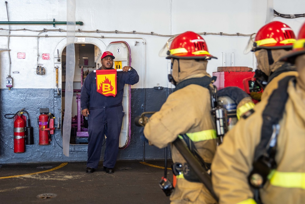 USS Ronald Reagan (CVN 76) Sailors conduct training during a general quarters drill