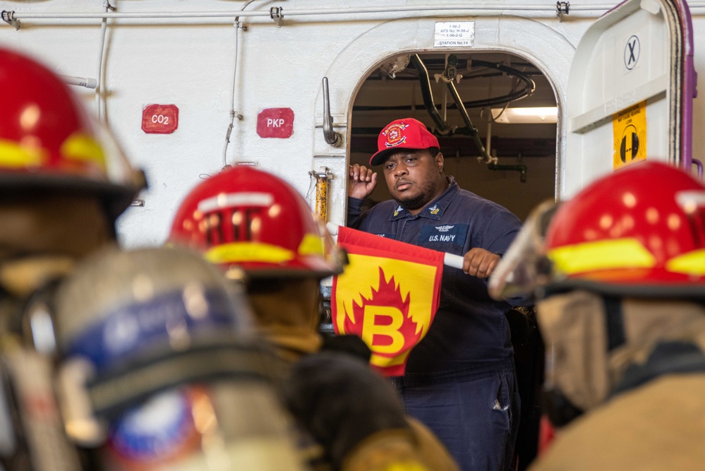 USS Ronald Reagan (CVN 76) Sailors conduct training during a general quarters drill