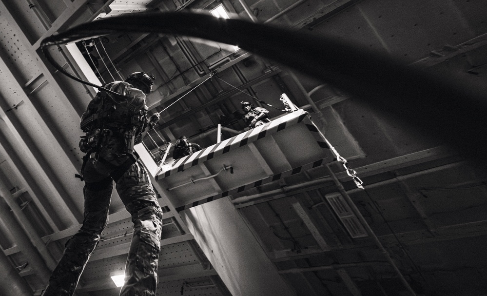 EODMU 5 Fast Ropes in the Hangar Bay of USS George Washington