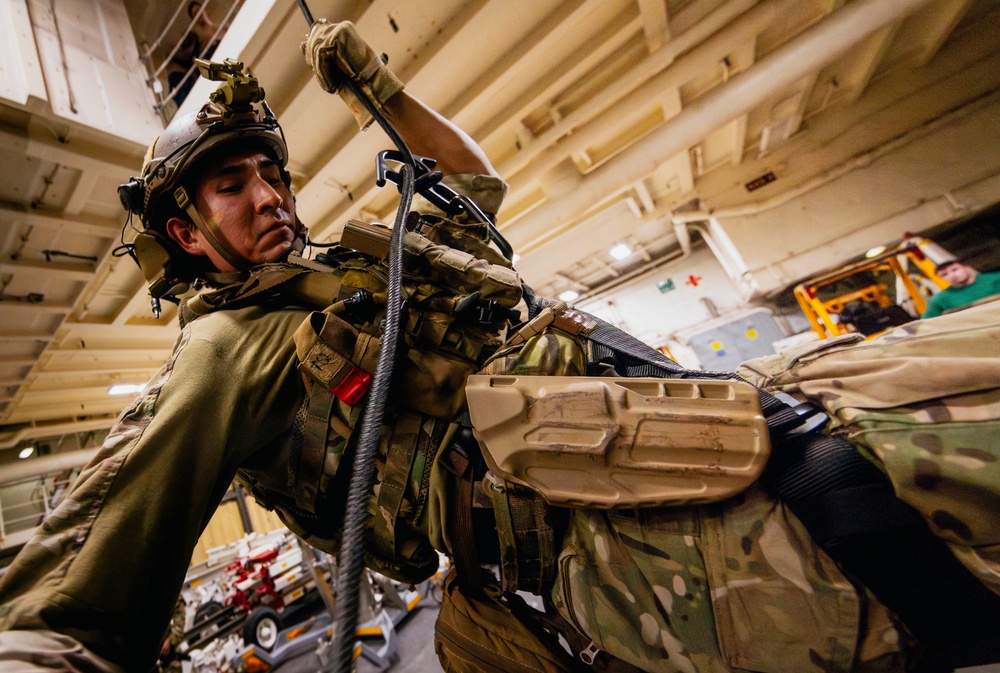 EODMU 5 Fast Ropes in the Hangar Bay of USS George Washington