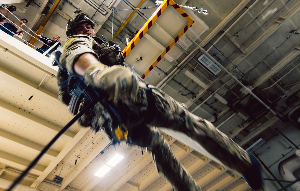 EODMU 5 Fast Ropes in the Hangar Bay of USS George Washington