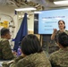 Military personnel from participating nations attend a medical presentation aboard the USS Howard during Sama Sama 2024