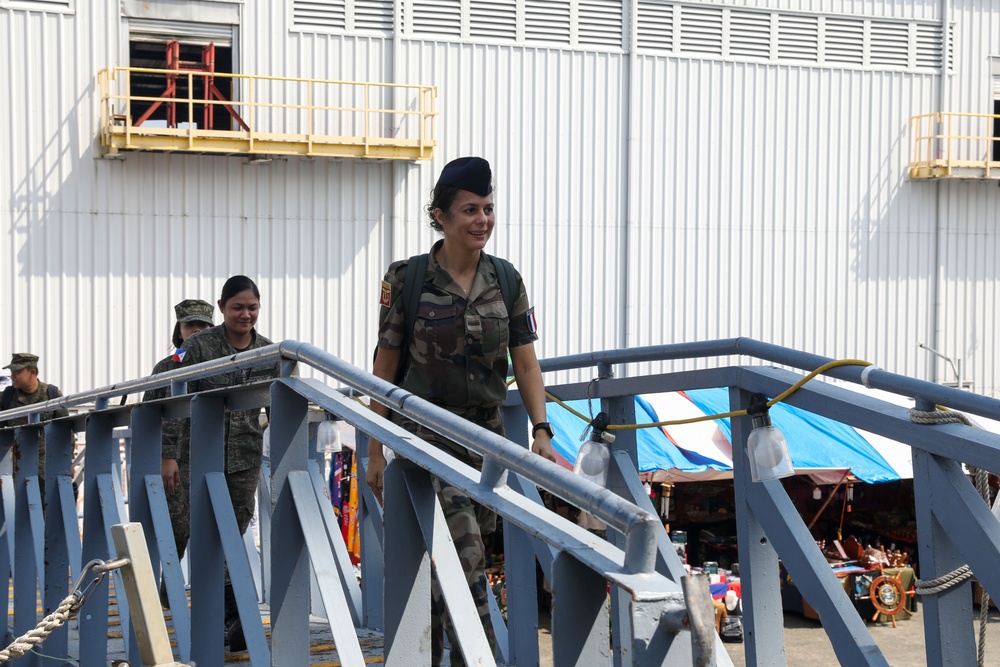 Military personnel from participating nations attend a medical presentation aboard the USS Howard during Sama Sama 2024