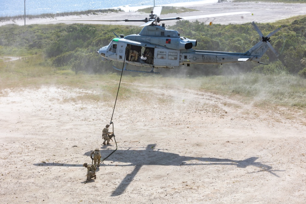 Multi-Purpose Canines Conduct Amphibious and Aerial Fast-Roping Training