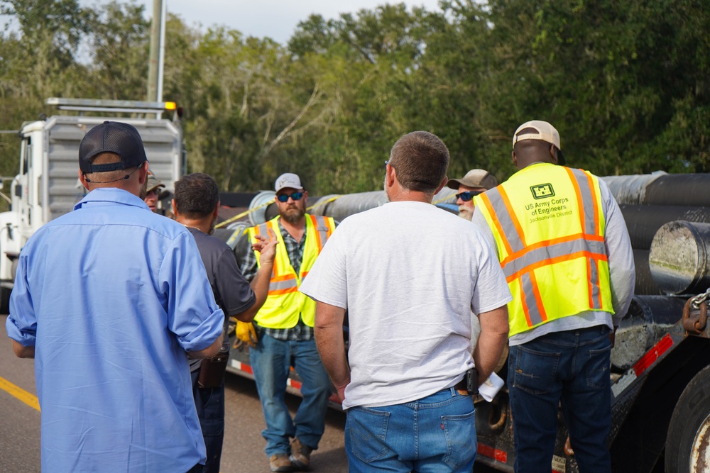 U.S. Army Corps of Engineers and South Florida Water Management work tirelessly to set up a pump system at Medard Reservoir to aid the flow of water to prevent flooding following Hurricane Milton on Oct. 10, 2024.