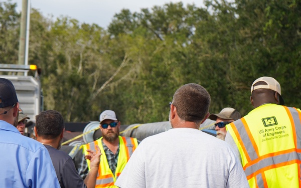 U.S. Army Corps of Engineers and South Florida Water Management work tirelessly to set up a pump system at Medard Reservoir to aid the flow of water to prevent flooding following Hurricane Milton on Oct. 10, 2024.