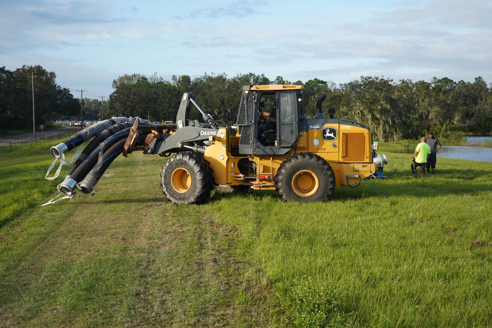 U.S. Army Corps of Engineers and South Florida Water Management work tirelessly to set up a pump system at Medard Reservoir to aid the flow of water to prevent flooding following Hurricane Milton on Oct. 10, 2024.