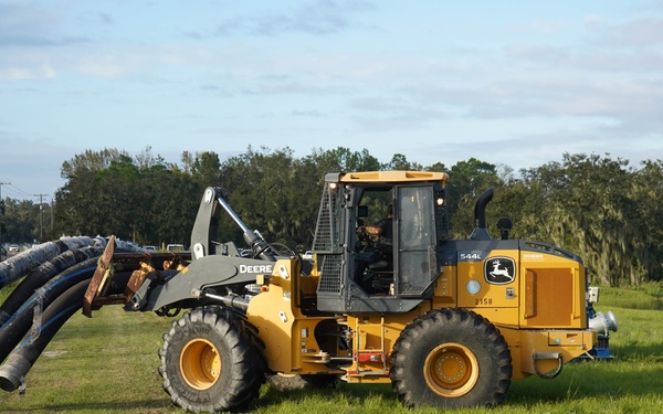 U.S. Army Corps of Engineers and South Florida Water Management work tirelessly to set up a pump system at Medard Reservoir to aid the flow of water to prevent flooding following Hurricane Milton on Oct. 10, 2024.