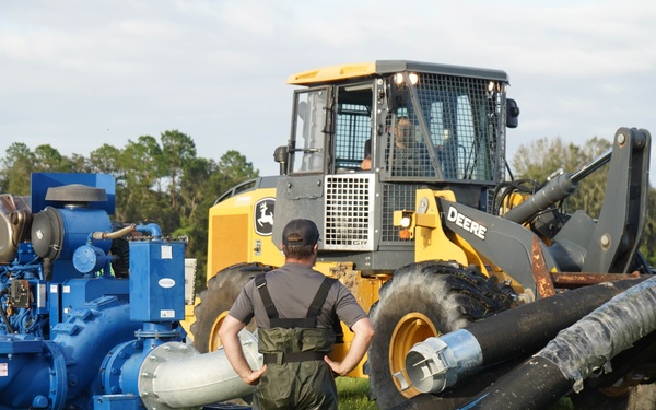 U.S. Army Corps of Engineers and South Florida Water Management work tirelessly to set up a pump system at Medard Reservoir to aid the flow of water to prevent flooding following Hurricane Milton on Oct. 10, 2024.