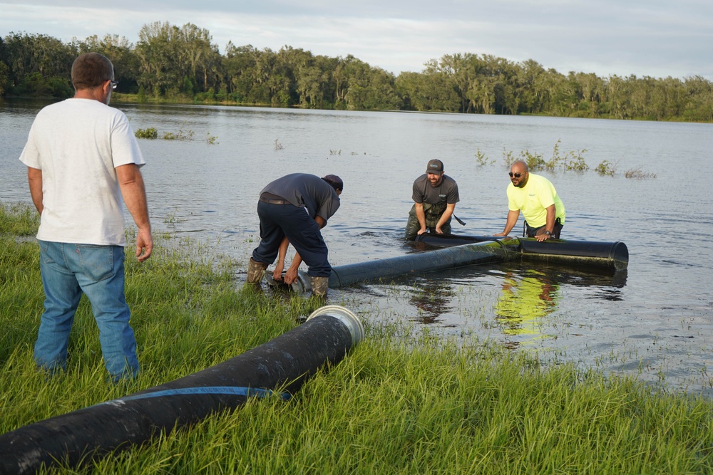 U.S. Army Corps of Engineers and South Florida Water Management work tirelessly to set up a pump system at Medard Reservoir to aid the flow of water to prevent flooding following Hurricane Milton on Oct. 10, 2024.