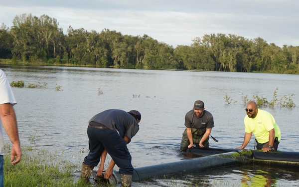 U.S. Army Corps of Engineers and South Florida Water Management work tirelessly to set up a pump system at Medard Reservoir to aid the flow of water to prevent flooding following Hurricane Milton on Oct. 10, 2024.