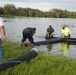 U.S. Army Corps of Engineers and South Florida Water Management work tirelessly to set up a pump system at Medard Reservoir to aid the flow of water to prevent flooding following Hurricane Milton on Oct. 10, 2024.