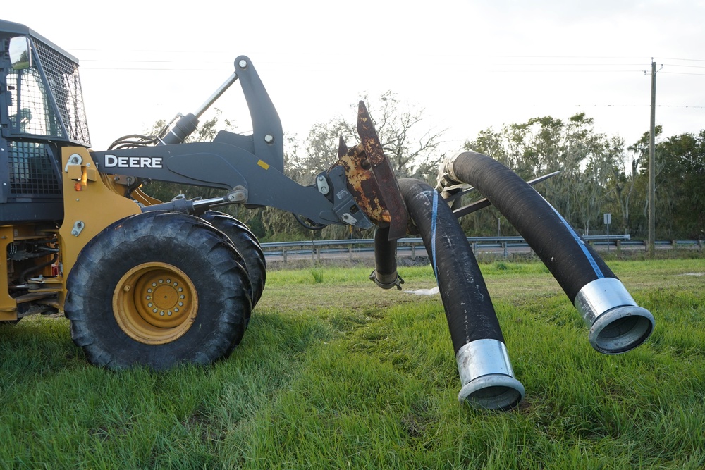 U.S. Army Corps of Engineers and South Florida Water Management work tirelessly to set up a pump system at Medard Reservoir to aid the flow of water to prevent flooding following Hurricane Milton on Oct. 10, 2024.