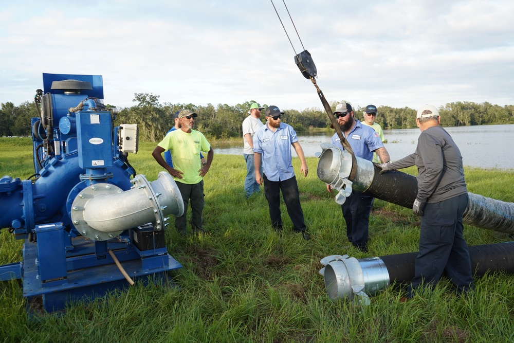U.S. Army Corps of Engineers and South Florida Water Management work tirelessly to set up a pump system at Medard Reservoir to aid the flow of water to prevent flooding following Hurricane Milton on Oct. 10, 2024.
