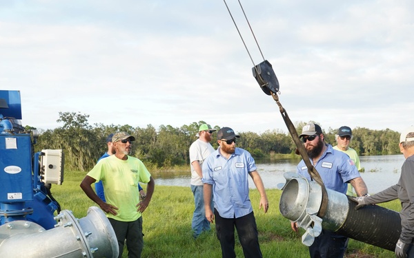 U.S. Army Corps of Engineers and South Florida Water Management work tirelessly to set up a pump system at Medard Reservoir to aid the flow of water to prevent flooding following Hurricane Milton on Oct. 10, 2024.