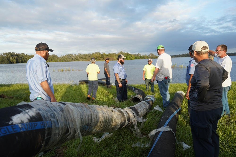 U.S. Army Corps of Engineers and South Florida Water Management work tirelessly to set up a pump system at Medard Reservoir to aid the flow of water to prevent flooding following Hurricane Milton on Oct. 10, 2024.