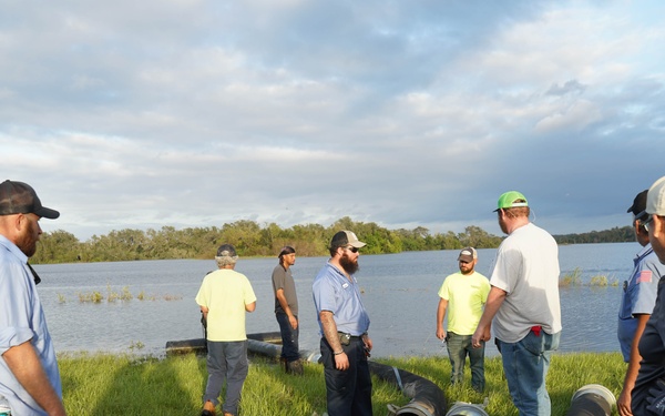 U.S. Army Corps of Engineers and South Florida Water Management work tirelessly to set up a pump system at Medard Reservoir to aid the flow of water to prevent flooding following Hurricane Milton on Oct. 10, 2024.