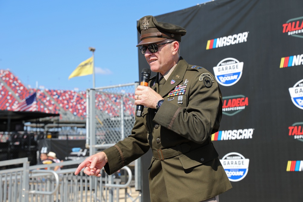 Army Reserve Soldier and country music star Craig Morgan performs the National Anthem alongside the 313th Army Band at the YellaWood 500