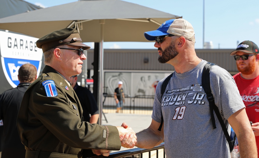 Army Reserve Soldier and country music star Craig Morgan performs the National Anthem alongside the 313th Army Band at the YellaWood 500