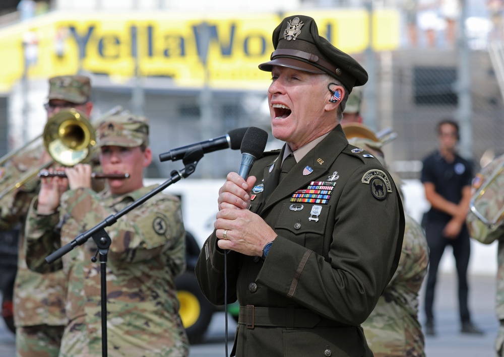 Army Reserve Soldier and country music star Craig Morgan performs the National Anthem alongside the 313th Army Band at the YellaWood 500