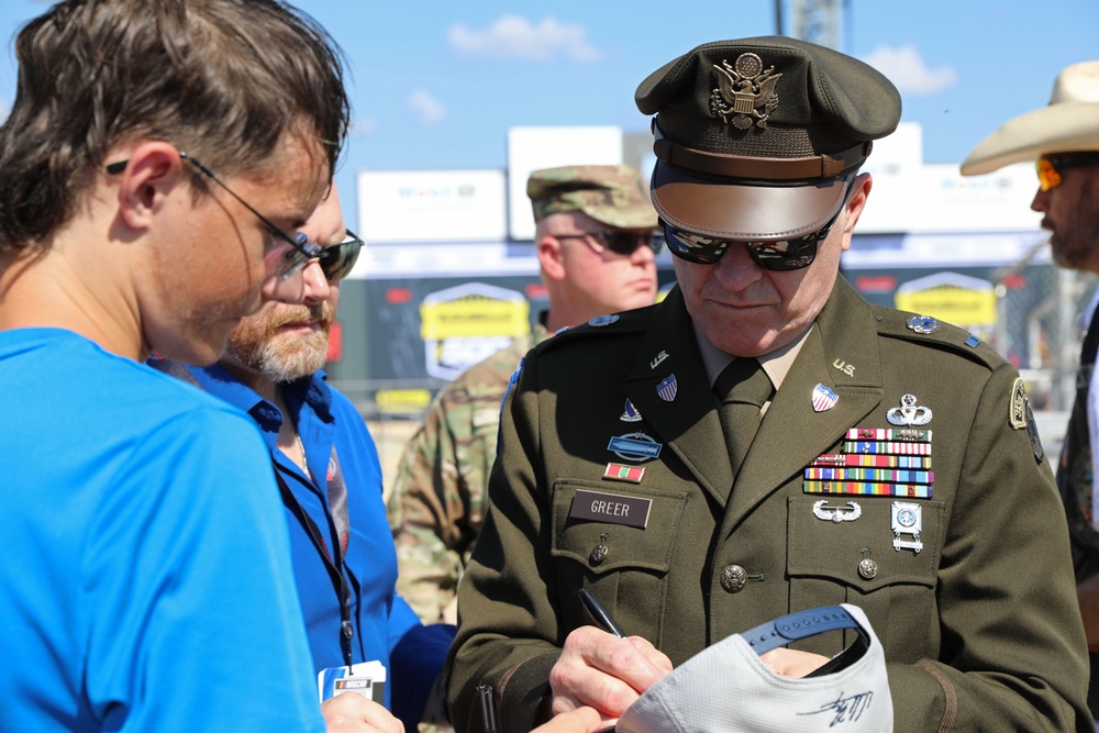 Army Reserve Soldier and country music star Craig Morgan performs the National Anthem alongside the 313th Army Band at the YellaWood 500