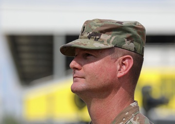 Army Reserve Soldier and country music star Craig Morgan performs the National Anthem alongside the 313th Army Band at the YellaWood 500