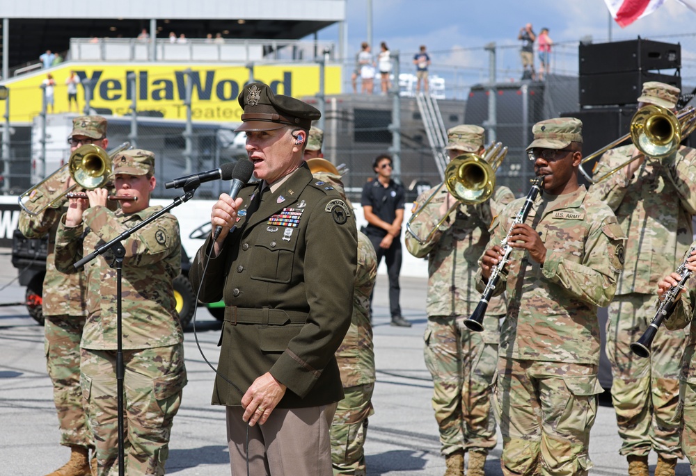 Army Reserve Soldier and country music star Craig Morgan performs the National Anthem alongside the 313th Army Band at the YellaWood 500