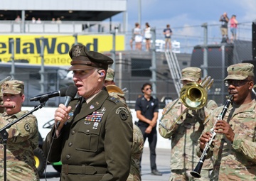 Army Reserve Soldier and country music star Craig Morgan performs the National Anthem alongside the 313th Army Band at the YellaWood 500