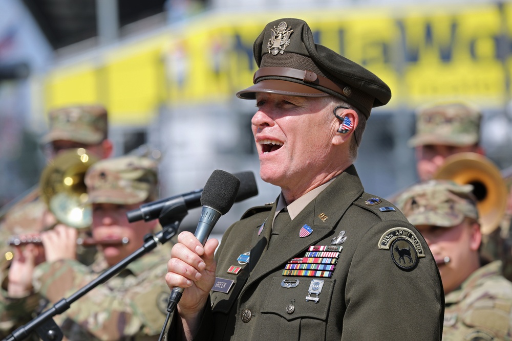 Army Reserve Soldier and country music star Craig Morgan performs the National Anthem alongside the 313th Army Band at the YellaWood 500