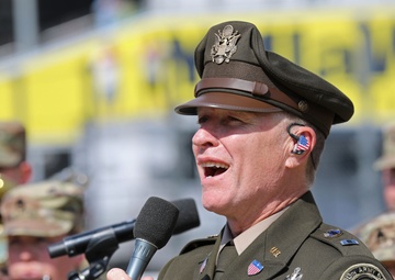 Army Reserve Soldier and country music star Craig Morgan performs the National Anthem alongside the 313th Army Band at the YellaWood 500