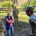 Screaming Eagles fix a fence and remove wreckage for a local citizen