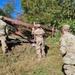 Screaming Eagles fix a fence and remove wreckage for a local citizen