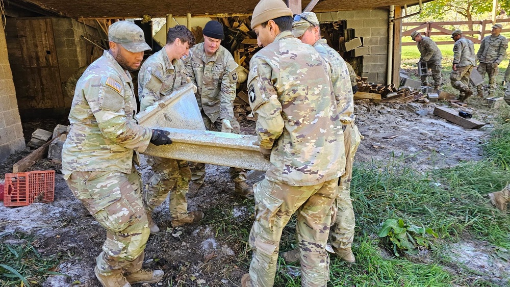 Screaming Eagles remove wreckage for a local citizen