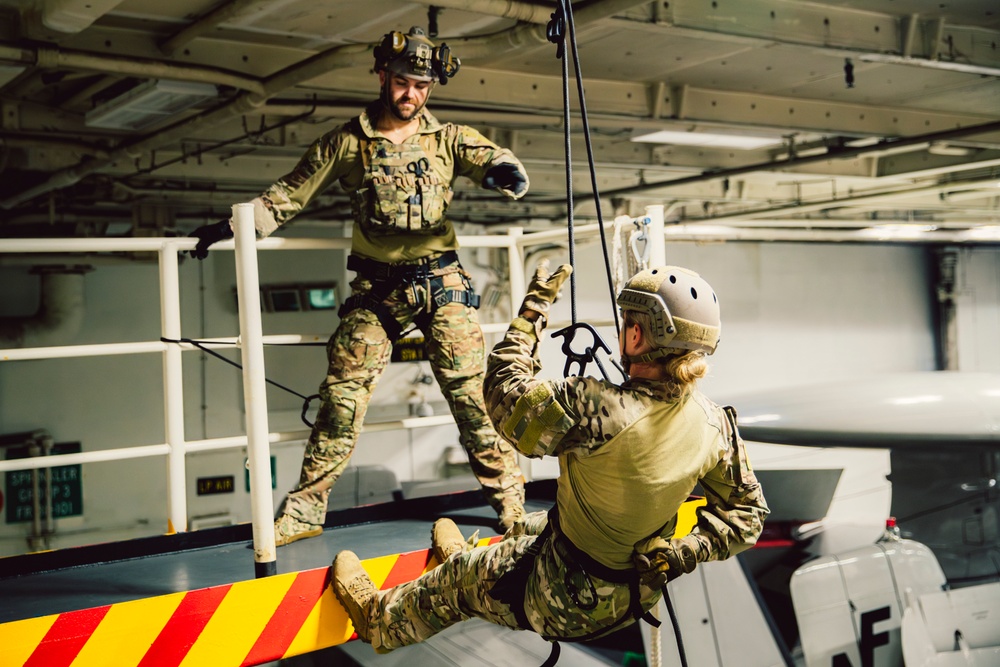 DVIDS - Images - EODMU 5 Fast Ropes in the Hangar Bay of USS George ...