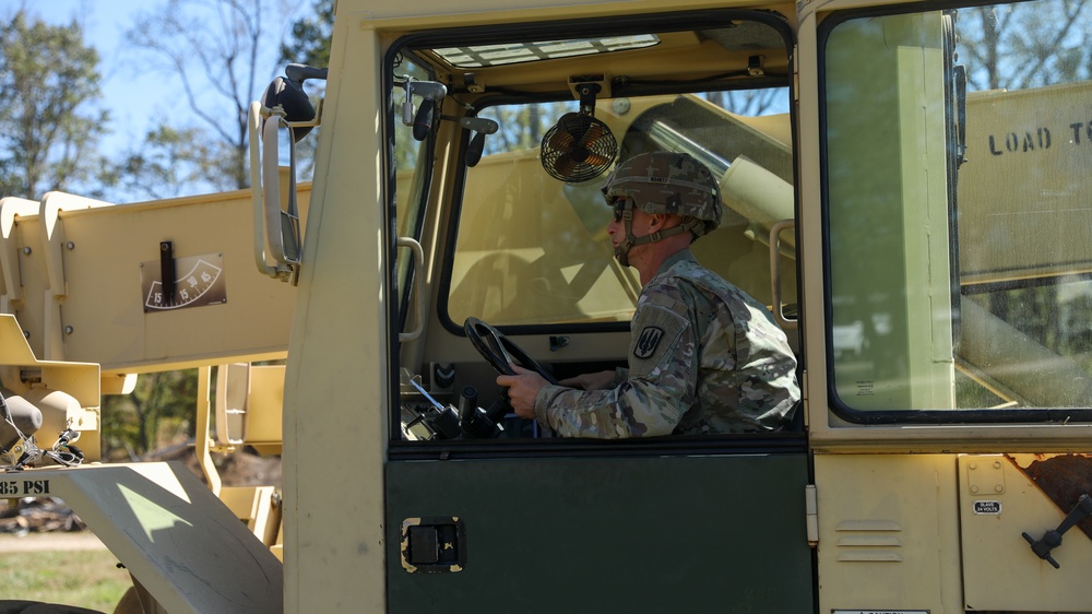 135th Forward Sustainment Support Company, 3-27 Field Artillery Regiment unload supplies in Marion, North Carolina