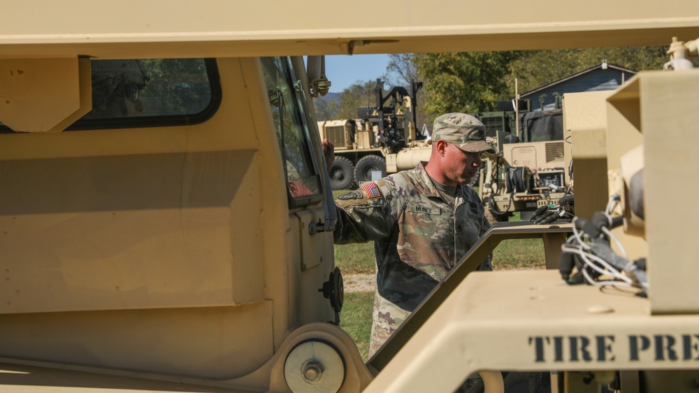 135th Forward Sustainment Support Company, 3-27 Field Artillery Regiment unload supplies in Marion, North Carolina