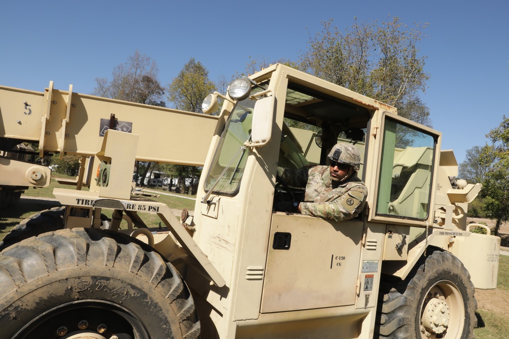 135th Forward Sustainment Support Company, 3-27 Field Artillery Regiment unload supplies in Marion, North Carolina