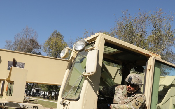 135th Forward Sustainment Support Company, 3-27 Field Artillery Regiment unload supplies in Marion, North Carolina