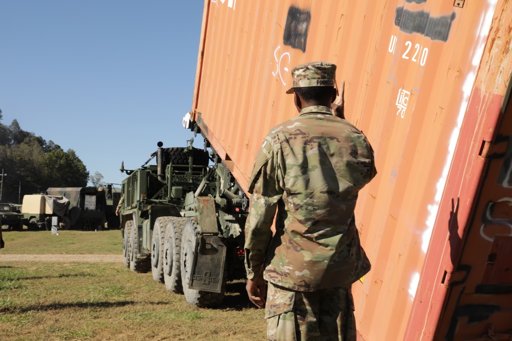 135th Forward Sustainment Support Company, 3-27 Field Artillery Regiment unload supplies in Marion, North Carolina