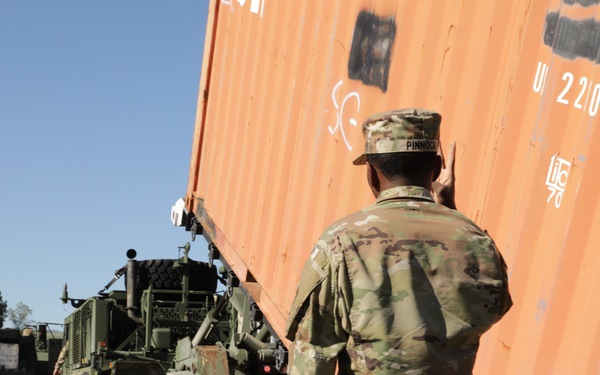135th Forward Sustainment Support Company, 3-27 Field Artillery Regiment unload supplies in Marion, North Carolina