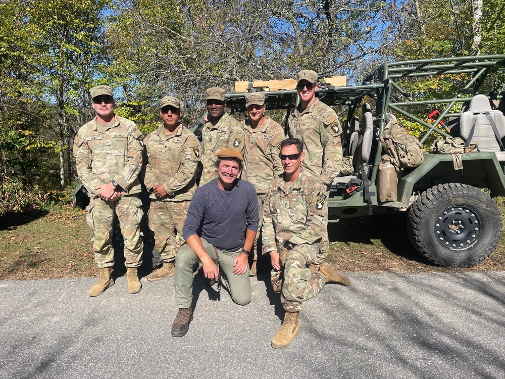 Screaming Eagle Soldiers meet Matthew Settle while on relief mission