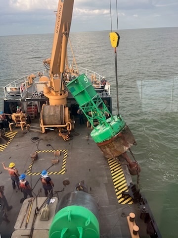 U.S. Coast Guard Cutter Joshua Appleby (WLM 556) personnel work buoys in Tampa Bay after Hurricane Milton