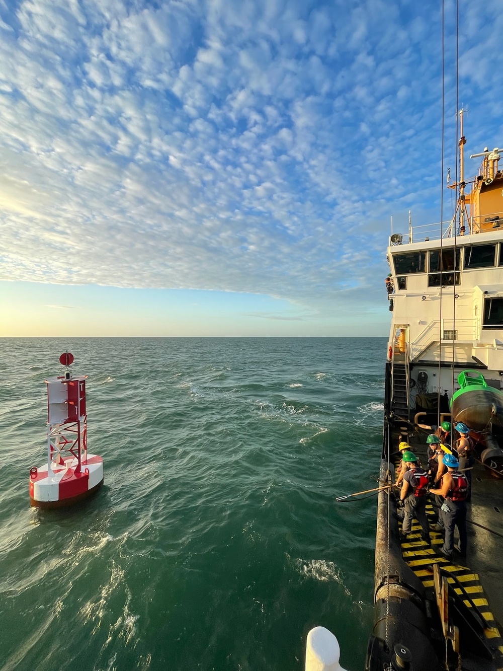 U.S. Coast Guard Cutter Joshua Appleby (WLM 556) personnel work buoys in Tampa Bay after Hurricane Milton